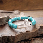 Cross bracelet with Turquoise color beads and silver hammered cross