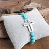 Cross bracelet with Turquoise color beads and silver hammered cross