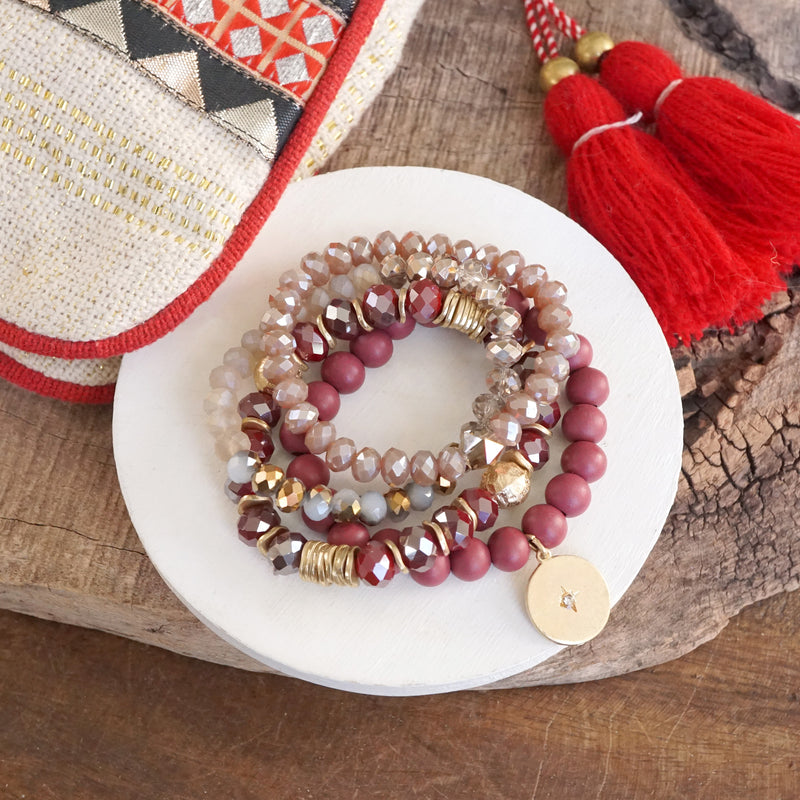 Beaded bracelets set in Red Burgundy with a coin charm