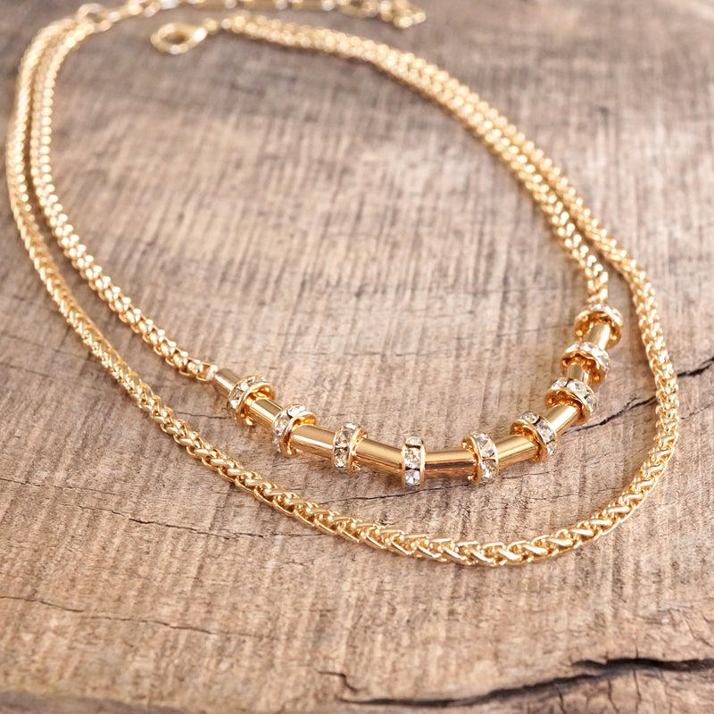 Layered Gold Chain Necklace with Cylinder and Crystal Accents