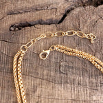 Layered Gold Chain Necklace with Cylinder and Crystal Accents