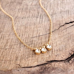 Dainty Crystal Bezel Necklace with Golden Ball Beads - Clear, Gray, Brown