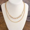 Layered Gold Chain Necklace with Cylinder and Crystal Accents