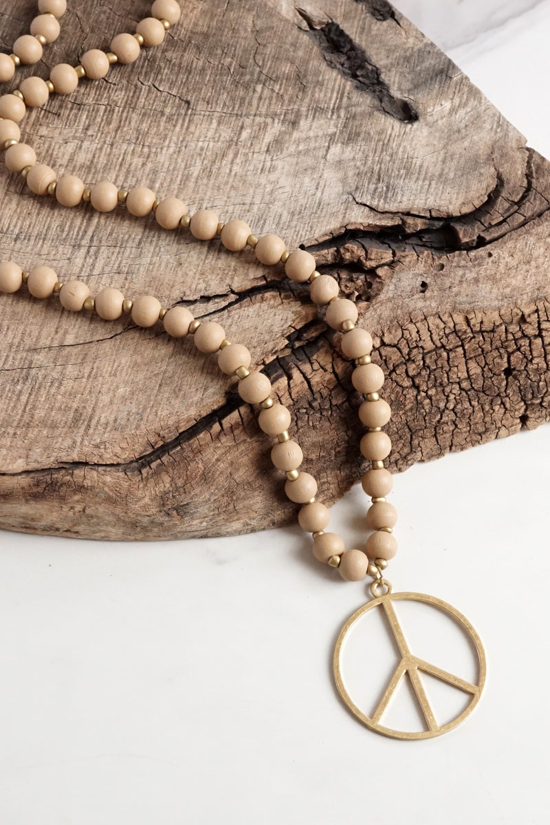 Long Wood Bead Necklace with golden peace sign pendant - Natural Beige