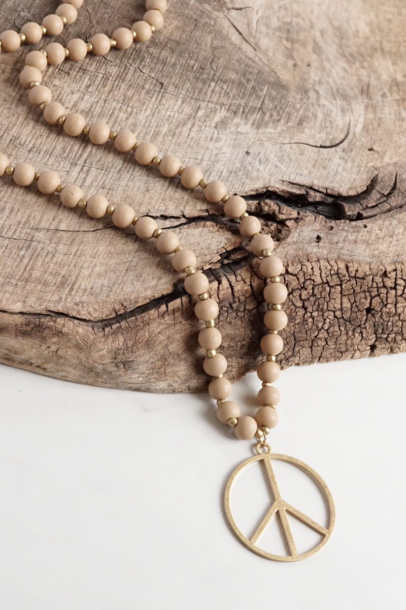 Long Wood Bead Necklace with golden peace sign pendant - Natural Beige