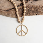 Long Wood Bead Necklace with golden peace sign pendant - Natural Beige