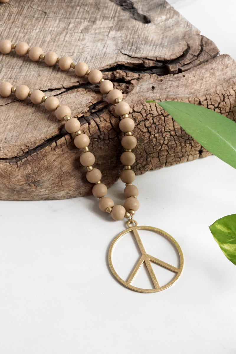 Long Wood Bead Necklace with golden peace sign pendant - Natural Beige