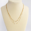 Multi chain short dainty necklace with 3 small pearls in gold tone