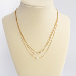 Multi chain short dainty necklace with 3 small pearls in gold tone