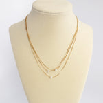 Multi chain short dainty necklace with 3 small pearls in gold tone