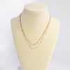 Multi chain short dainty necklace with 3 small pearls in gold tone