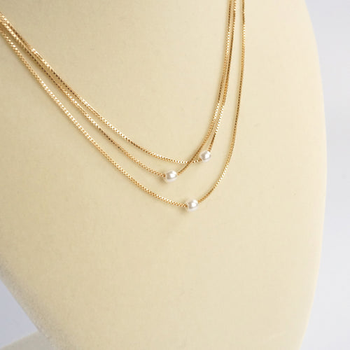 Multi chain short dainty necklace with 3 small pearls in gold tone