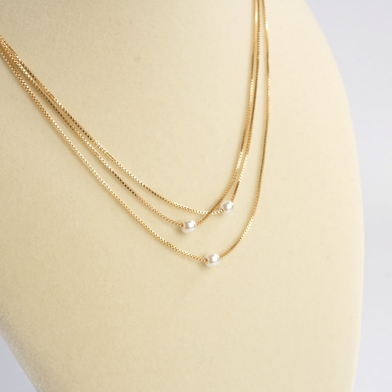 Multi chain short dainty necklace with 3 small pearls in gold tone