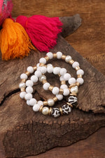 Bracelet Stack of 3 pieces white wood, pearls, golden and animal print beads