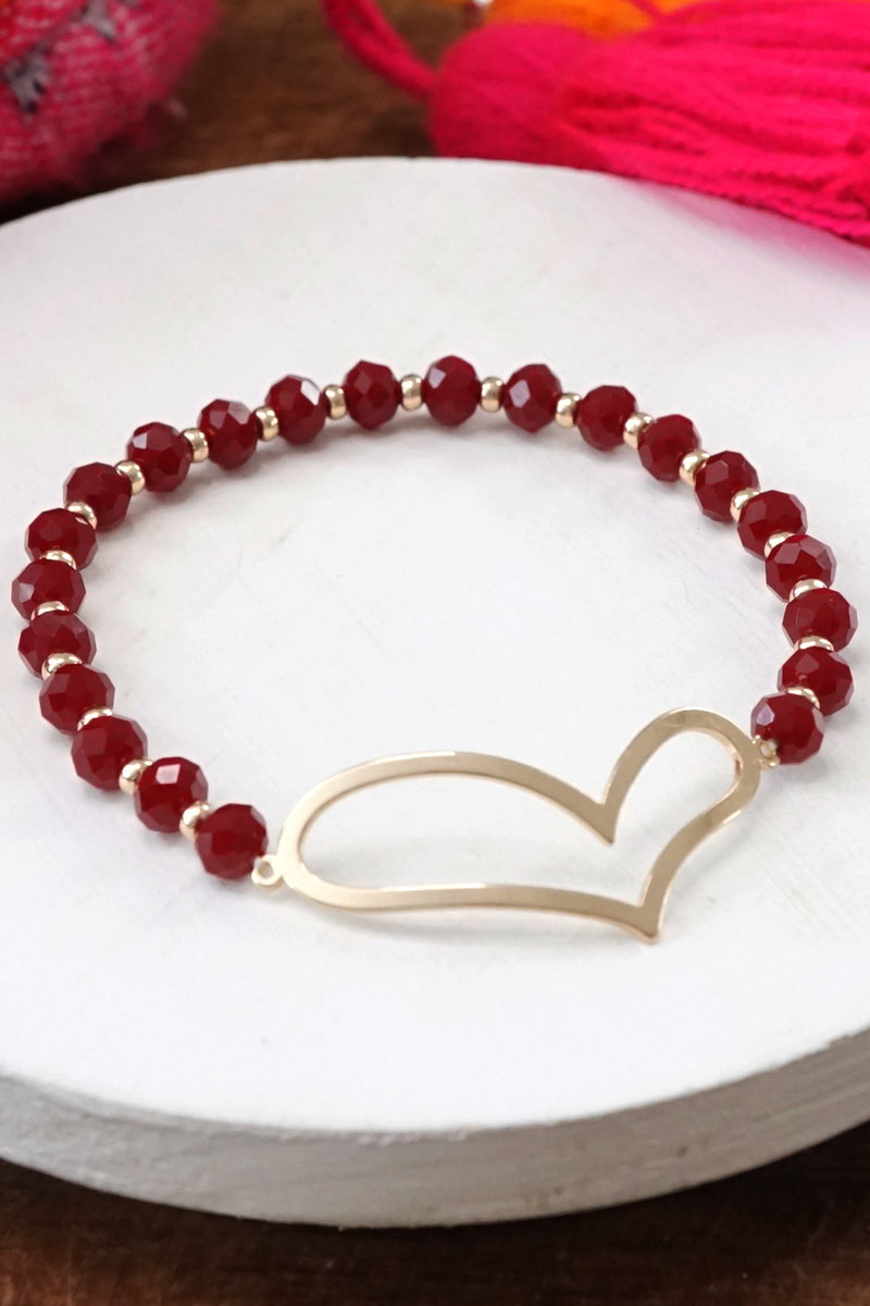 Burgundy beads bracelet with a cut out big Heart in gold tone