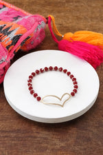 Burgundy beads bracelet with a cut out big Heart in gold tone