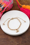 Drawstring golden chain bracelet with a heart charm