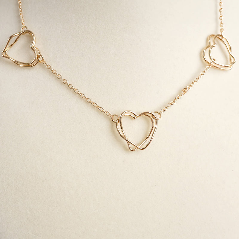 Wire-Inspired Hearts Necklace – Gold Tone