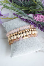 Beaded Bracelets Set of 4 bracelets Pink glass metal and natural wood beads