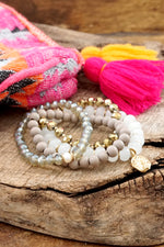 Beaded Bracelets set in White and Gray with a coin charm