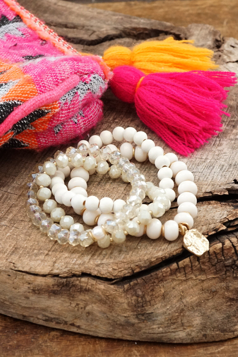 Beaded Bracelets set in White with a coin charm