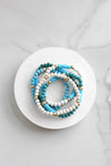 Blue stack of 5 clay and wood beads bracelets in blues and white