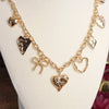 Multi-Charm Heart Necklace – Gold Tone