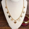 Multi-Charm Heart Necklace – Gold Tone