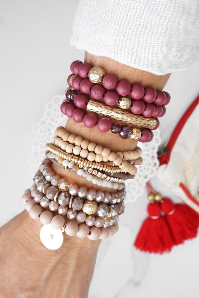 Beaded bracelets set in Blush Pink with a coin charm