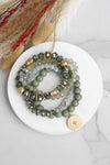 Beaded bracelets set in Olive green with a coin charm