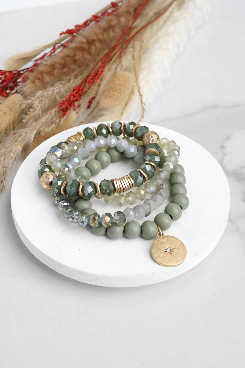 Beaded bracelets set in Olive green with a coin charm