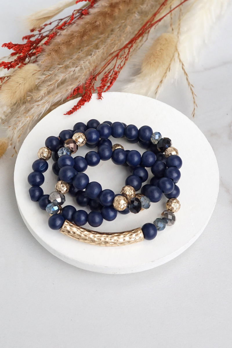 Beaded bracelets set in Wooden Navy Blue and Gold tube