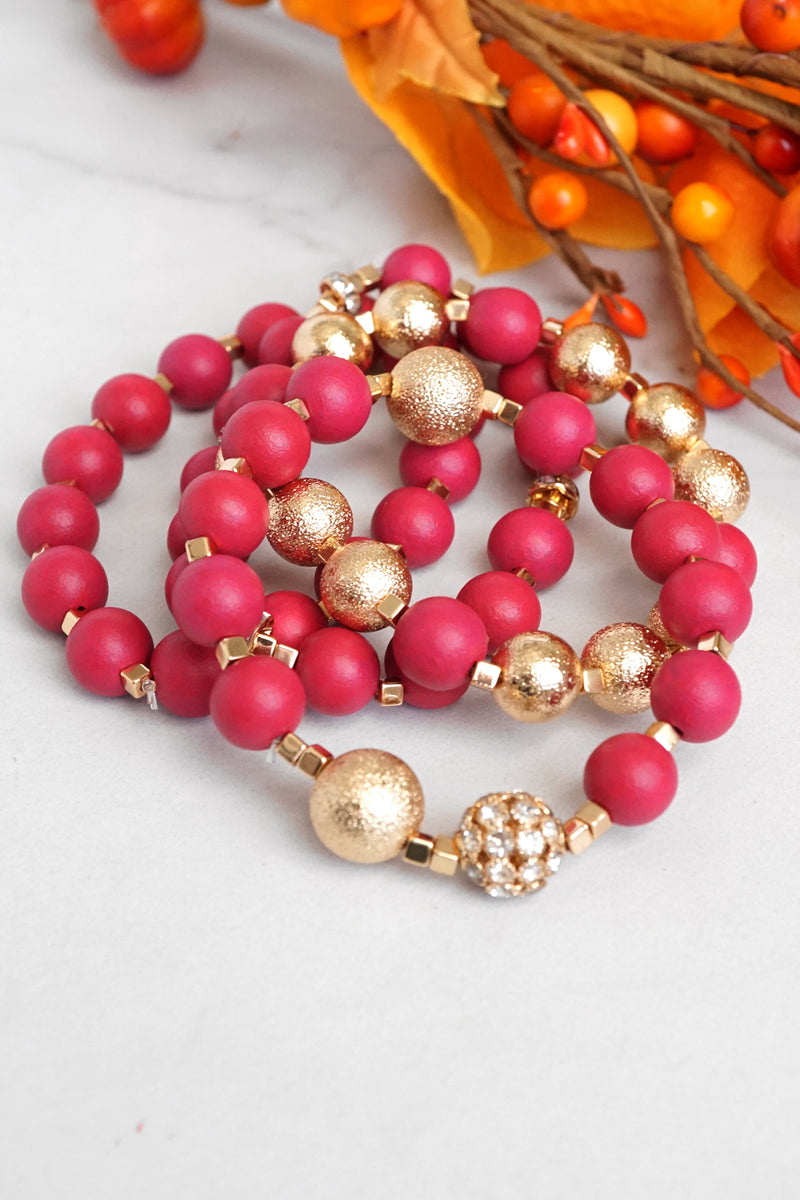 Beaded bracelets set in Red and Gold with clear crystals