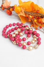 Beaded bracelets set in Red and Gold with clear crystals