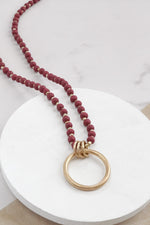 Long Wooden Bead Necklace with gold circle ring - Red Burgundy