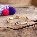 Jeweled Golden Bangle - with Faceted glass oval colorful jewels