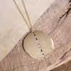 Long Worn Gold Hammered Disc Necklace with Crystal Accents