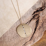 Long Worn Gold Hammered Disc Necklace with Crystal Accents