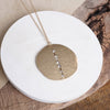 Long Worn Gold Hammered Disc Necklace with Crystal Accents