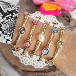 Jeweled Golden Bangle - with Faceted glass oval colorful jewels