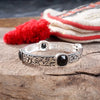 Classic Silver Tone Filigree Station Bangle with Black Stone Accents