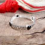 Classic Silver Tone Filigree Station Bangle with Black Stone Accents