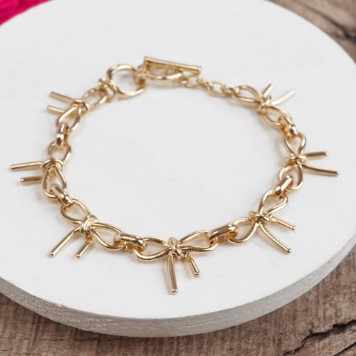 Bow Link Bracelet Gold Tone