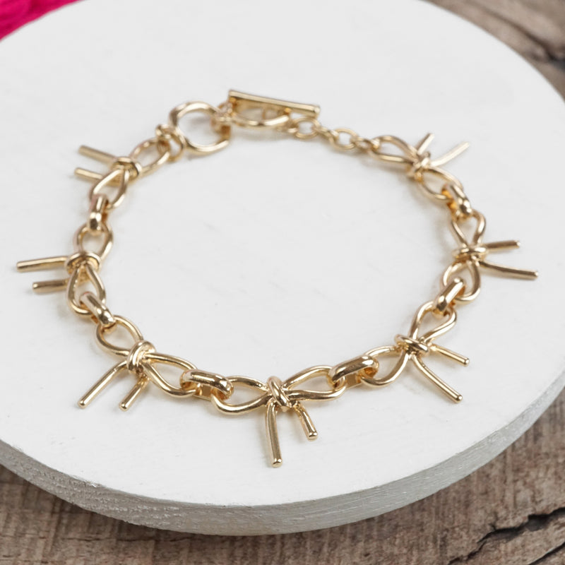 Bow Link Bracelet Gold Tone