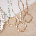 Long Wooden Bead Necklace with Clover Quatrefoil gold pendant - nude