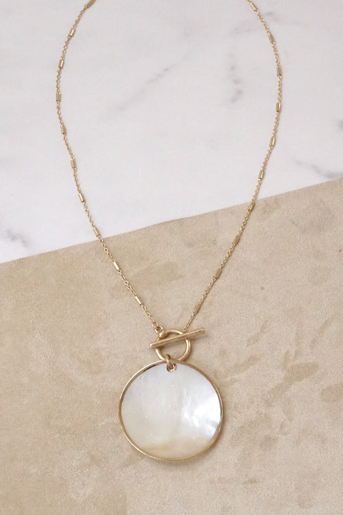 Minimalist boho short gold necklace with golden framed round shell