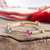 Jeweled Golden Bangle - with Faceted glass oval colorful jewels